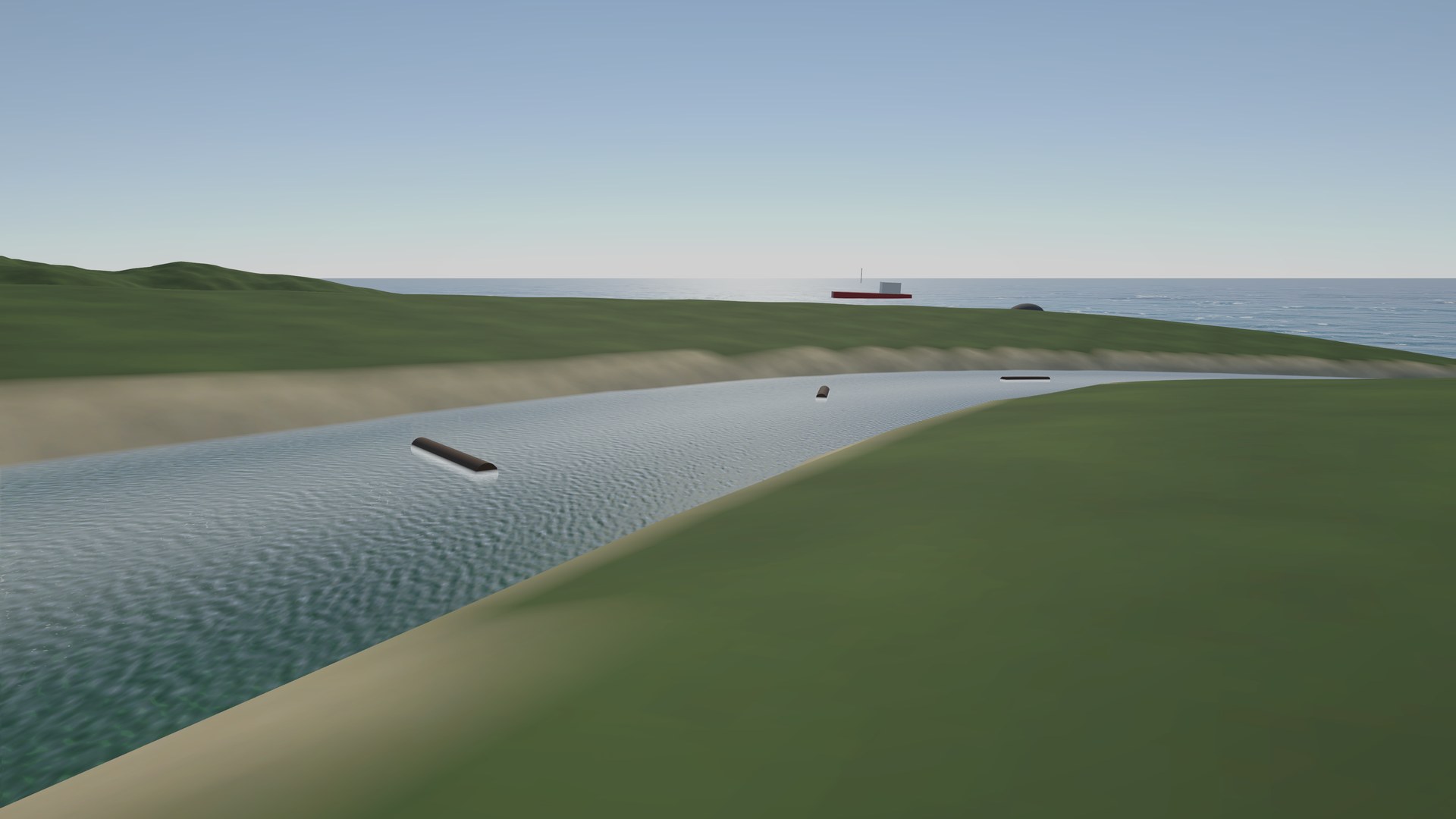 A river running between grassy banks towards the sea, with logs drifting in the current